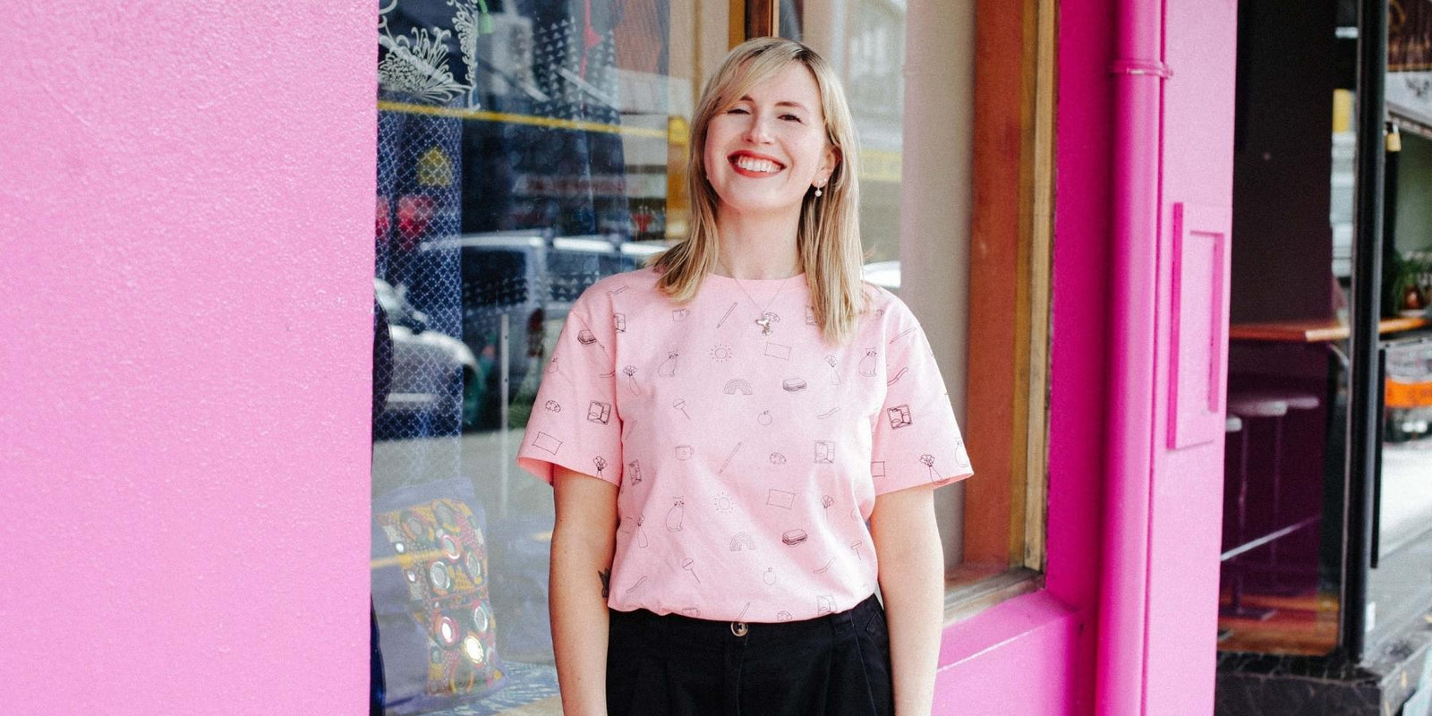 ruby wearing all over screen printed pink tshirt